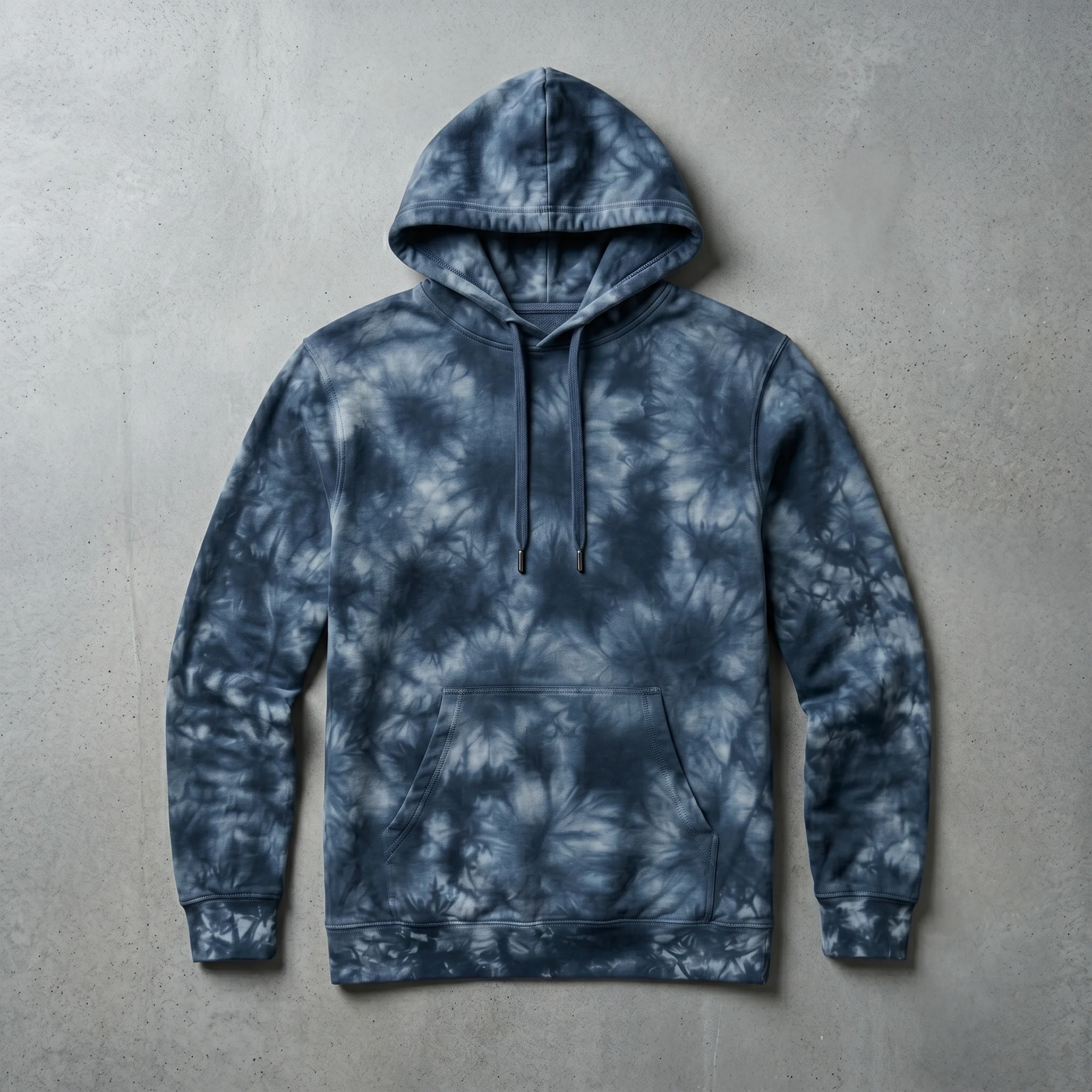 Navy tie-dye hoodie laid flat, showing the front, hood, and kangaroo pocket