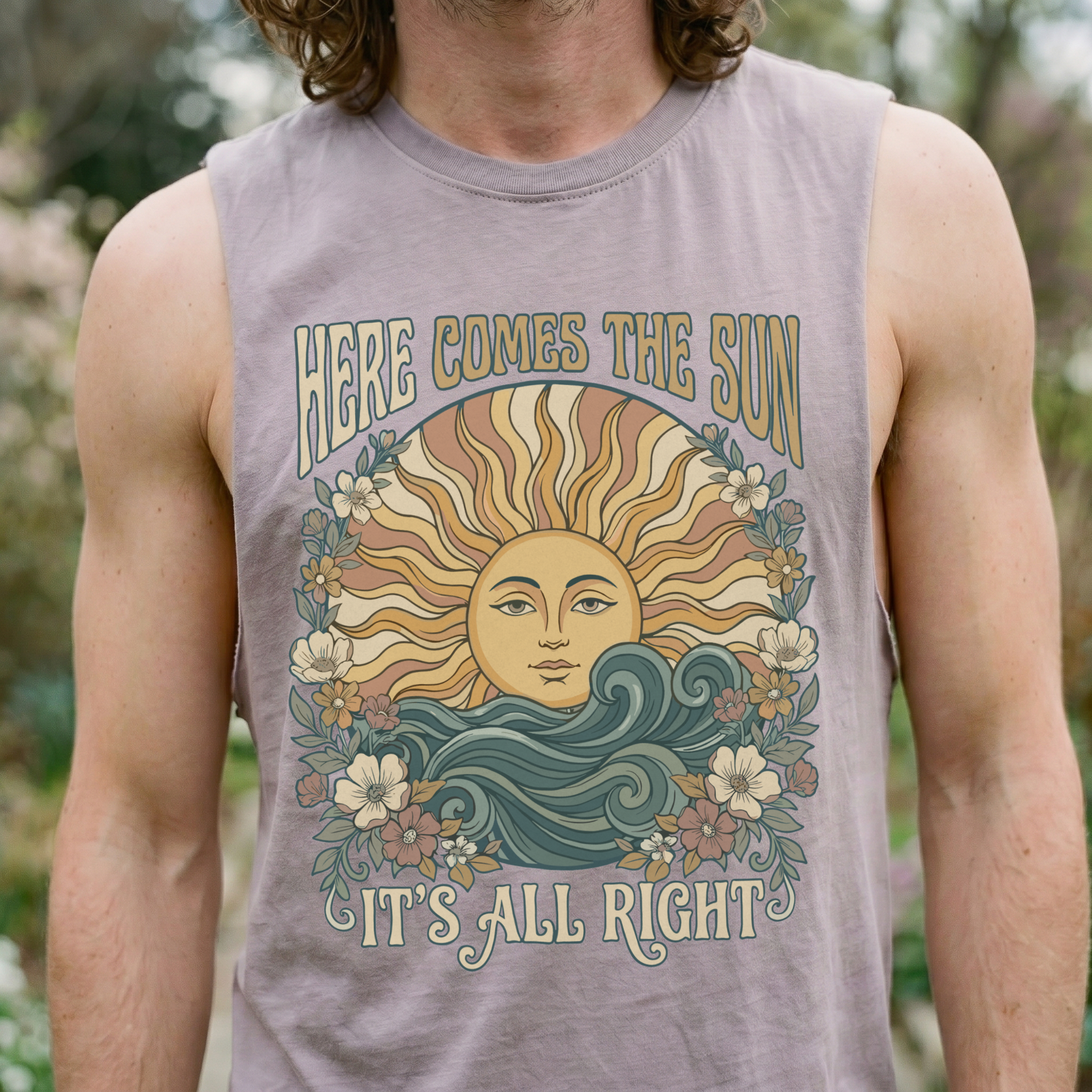 Close-up front view of a man wearing an orchid tank top with the 70s sun-goddess graphic — art nouveau sun face, waves, and floral border