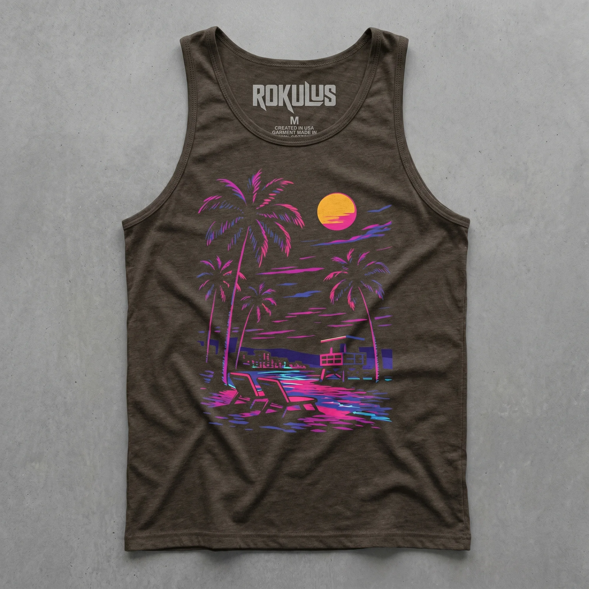 Charcoal black triblend tank top laid flat on concrete, showing the Retro Neon Beach graphic with pink and purple palm trees, sunset, and beach chairs