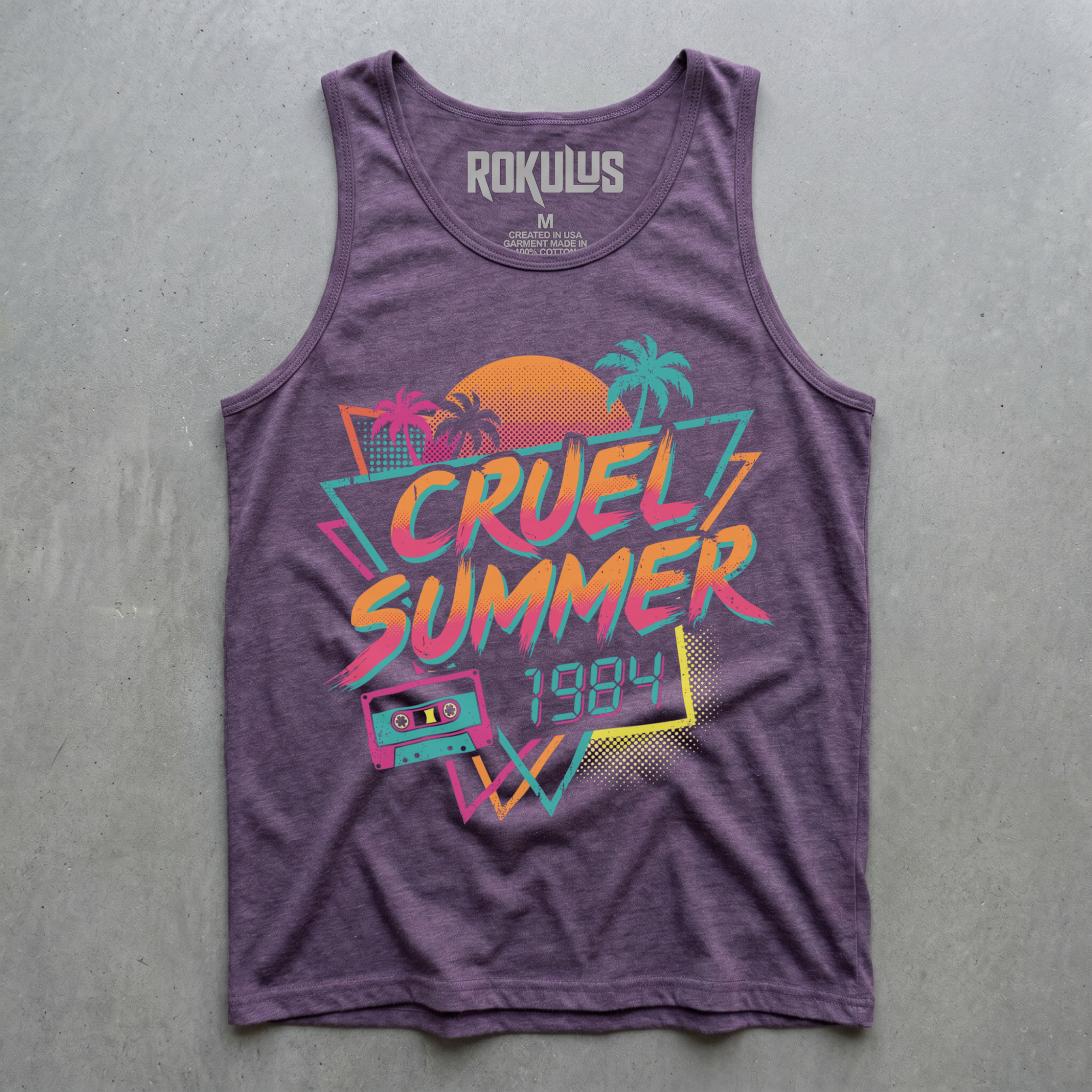 Heather purple tank top laid flat on concrete, showing the Cruel Summer 1984 neon graphic with palm trees, sunset, and a cassette tape, plus the Rokulus inner-neck label