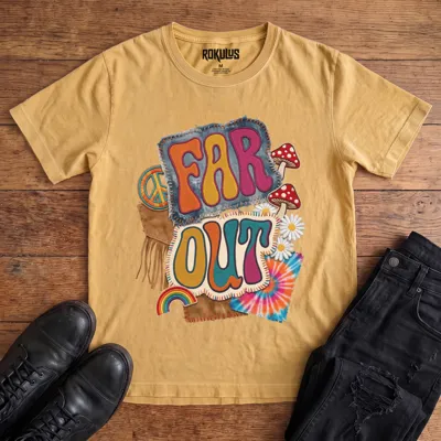 Washed mustard yellow Rokulus Far Out vintage graphic tee laid flat on wood with black boots and jeans, front print showing a groovy 70s patch collage with mushrooms, daisies, a peace sign, rainbow, and tie-dye around puffy “Far Out” lettering
