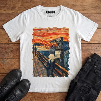 White Rokulus Scream Sound System vintage graphic tee laid flat on wood with black boots and jeans, front print showing a Scream-style painting with the screaming figure covering his ears beside a wall of speaker cabinets blasting into an orange sky